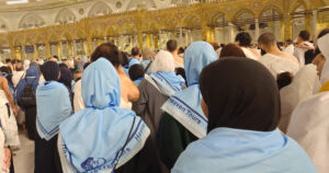 Heaven Tours Umrah group inside Masjid Al-Haram Makkah wearing Heaven Tours scarves