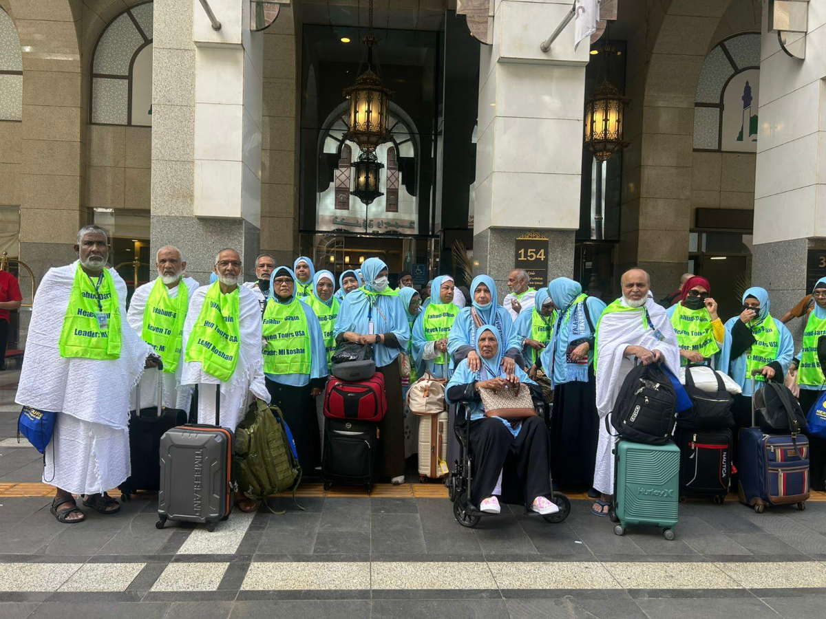 Heaven Tours travelers in Ihram preparing for Umrah at hotel in Makkah